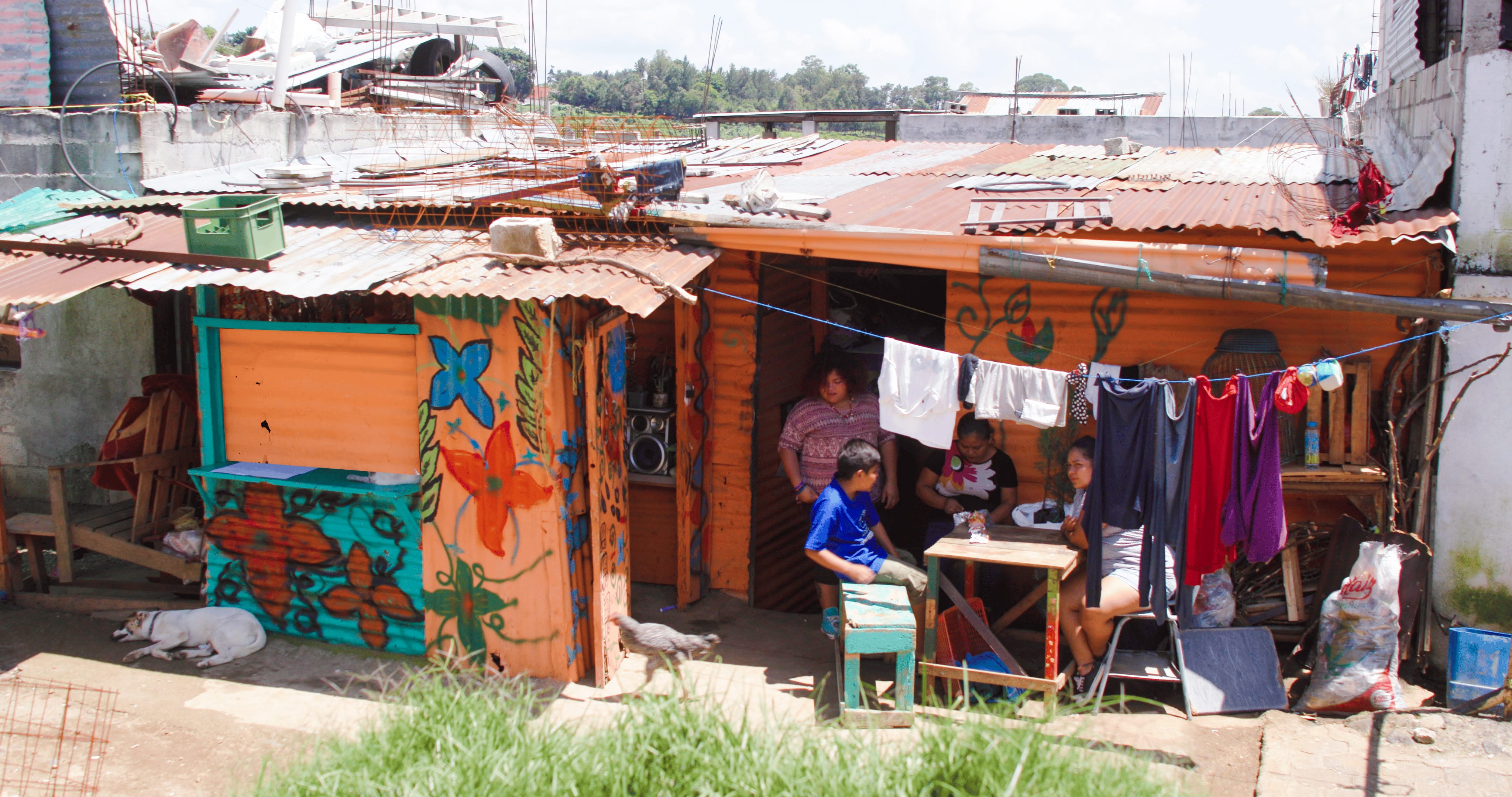 Family sitting outside of home