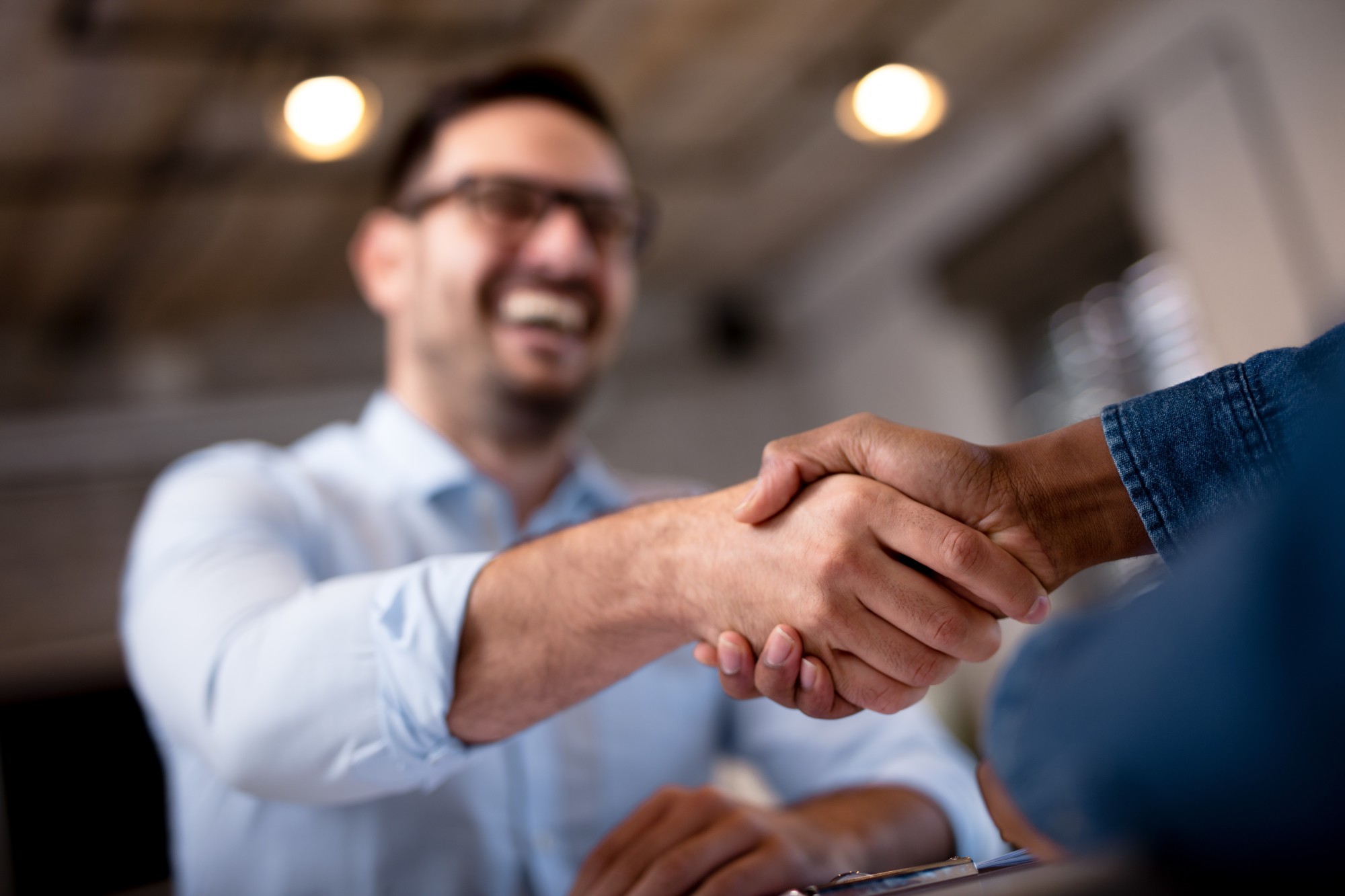 Handshake in professional business setting