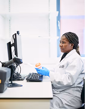 Woman working in lab with test sample