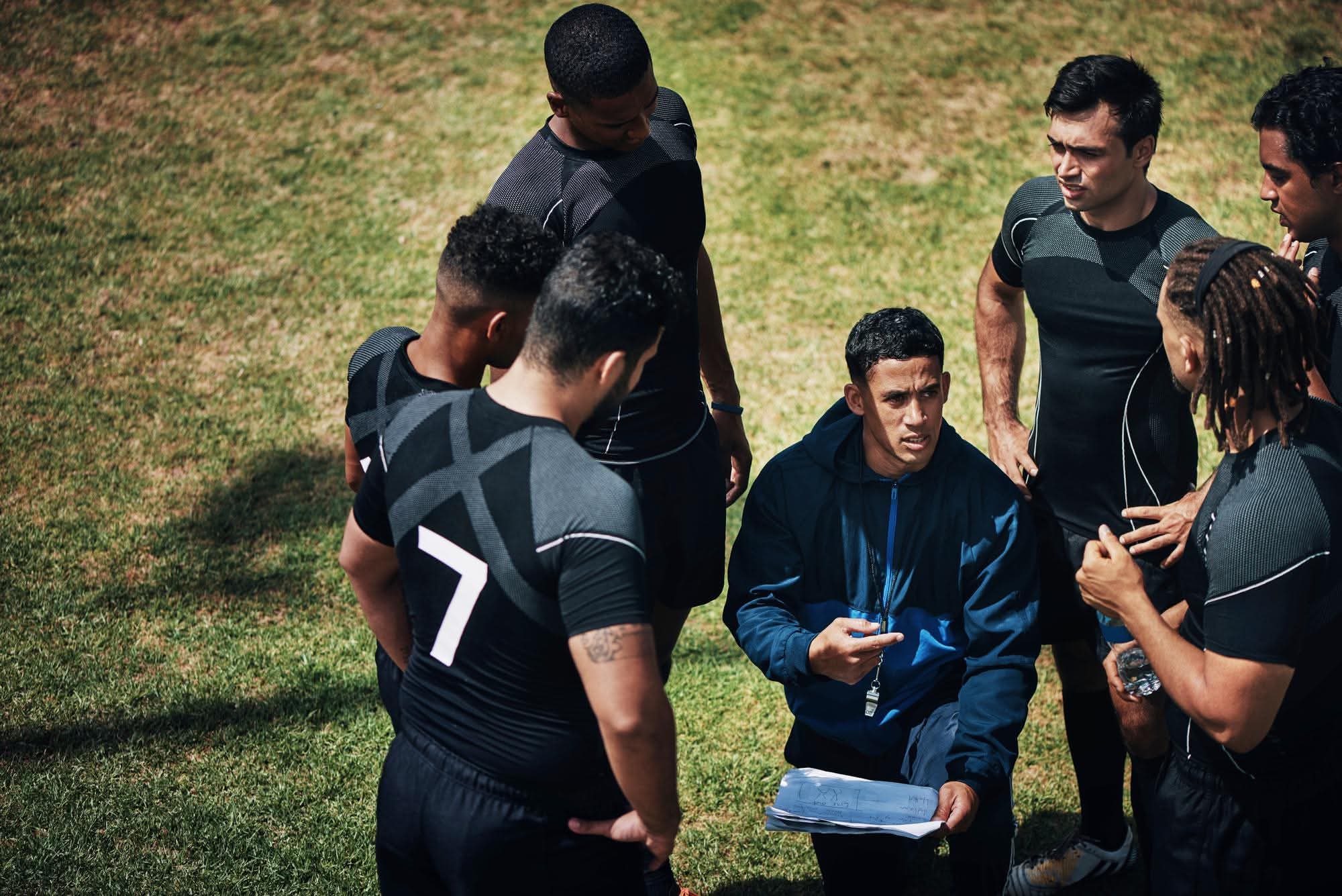 Everyone here cropped shot handsome young rugby coach