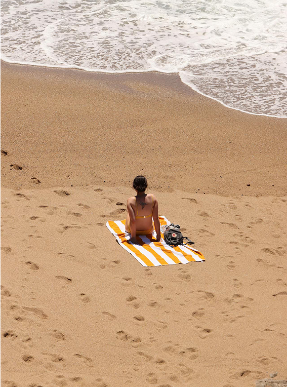 Picture woman taking sun in the beach.
