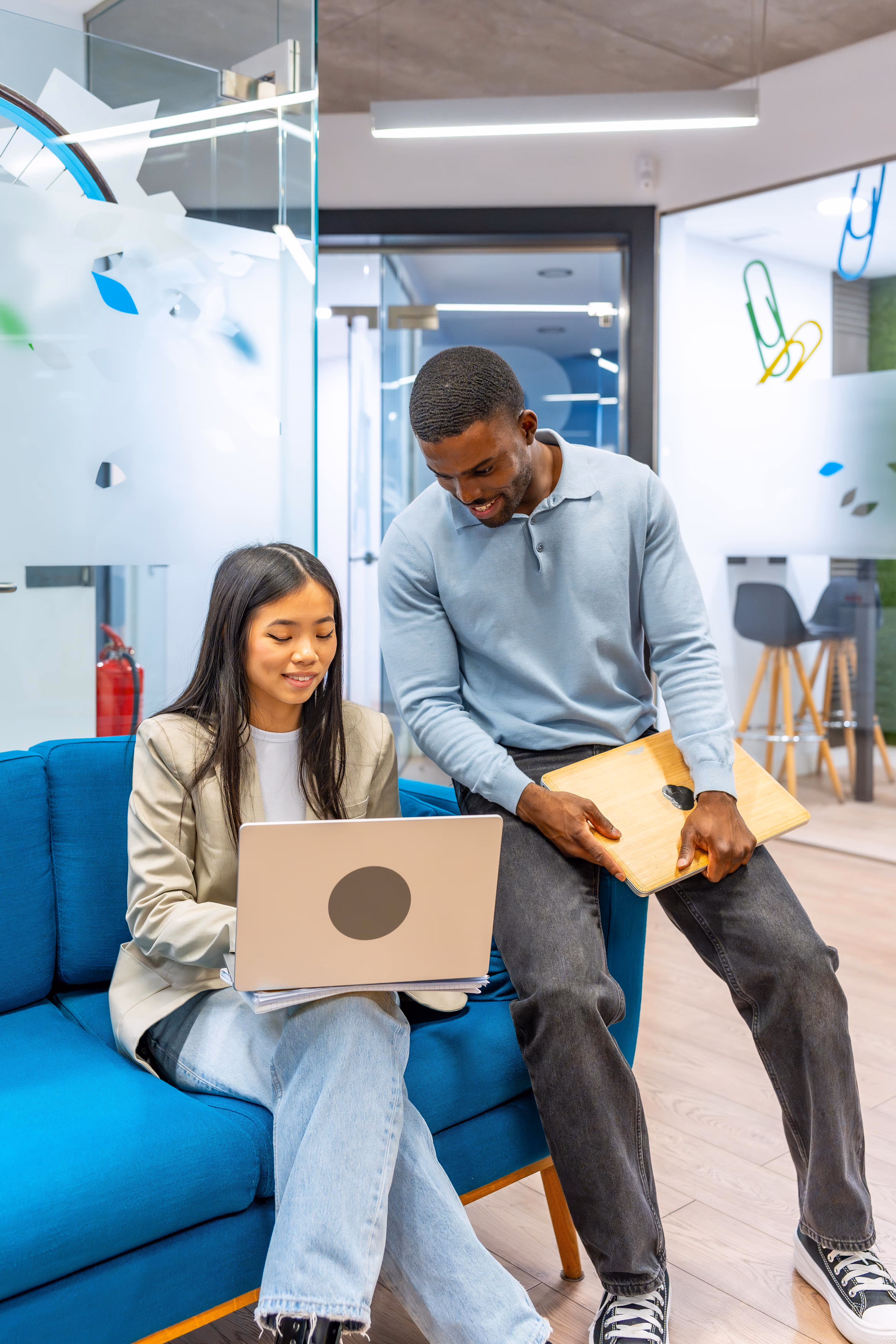 Photo of two people working together