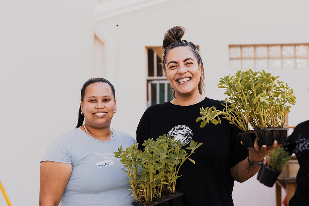 Two ladies volunteering to plant fynbos seedlings