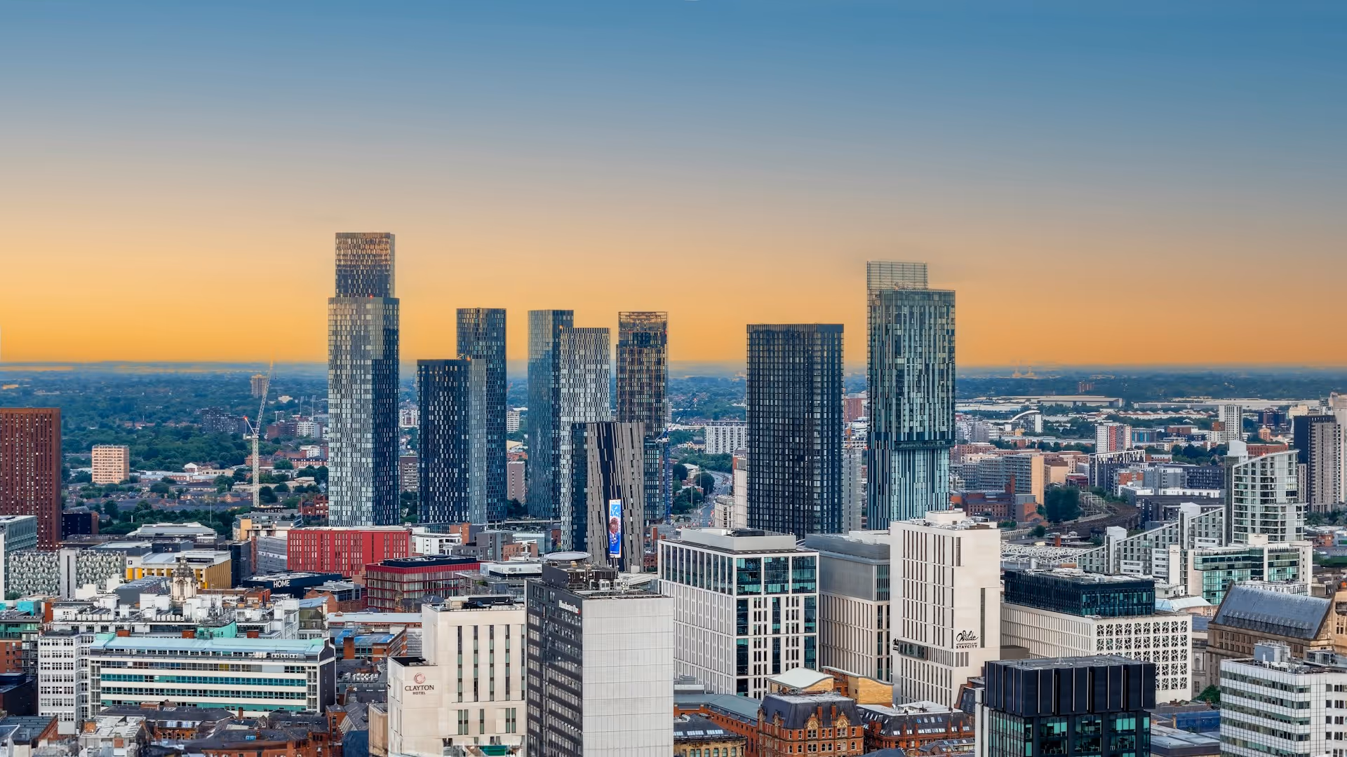 Manchester city from above with lots of newly constructed skyscrapers.