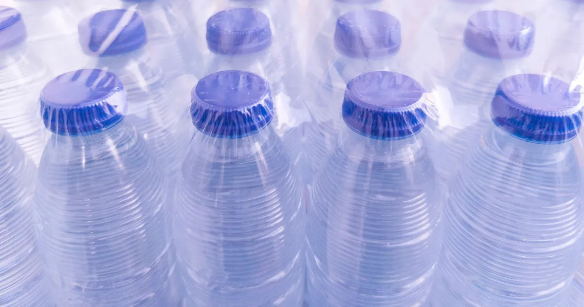 Shrink wrap covering water bottles.