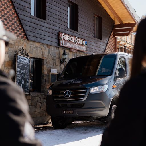 Van pulling up to a skii resort