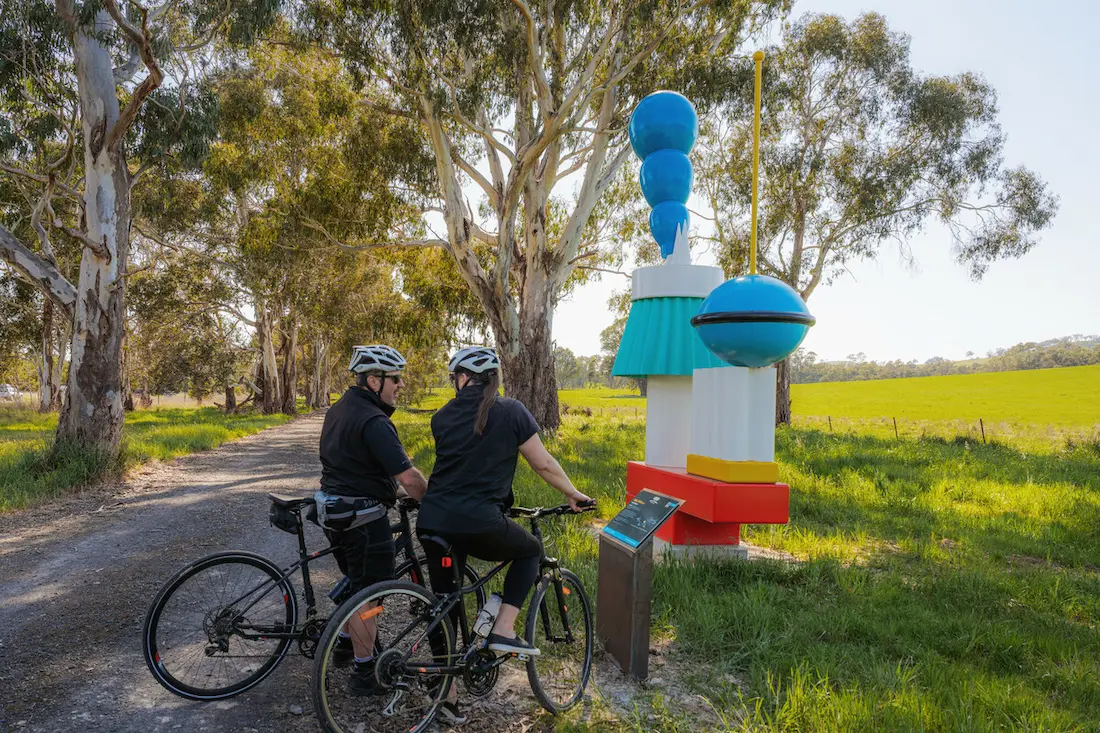 Bikers looking at an artifact