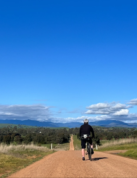 Biker on a gravel road