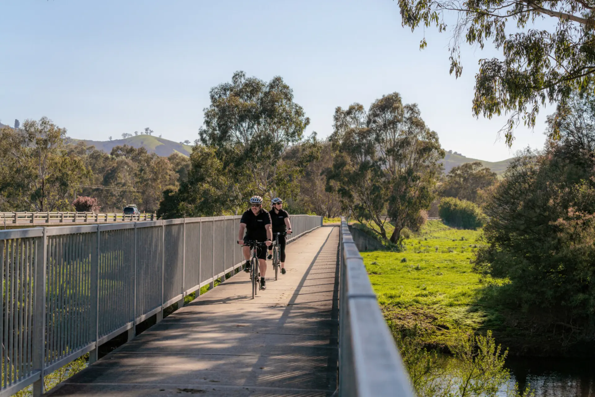 Riding bikes across a bridge