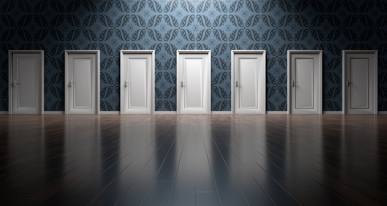 A row of closed doors in a patterned room, with one door subtly brighter than the others, suggesting choice and uncertainty