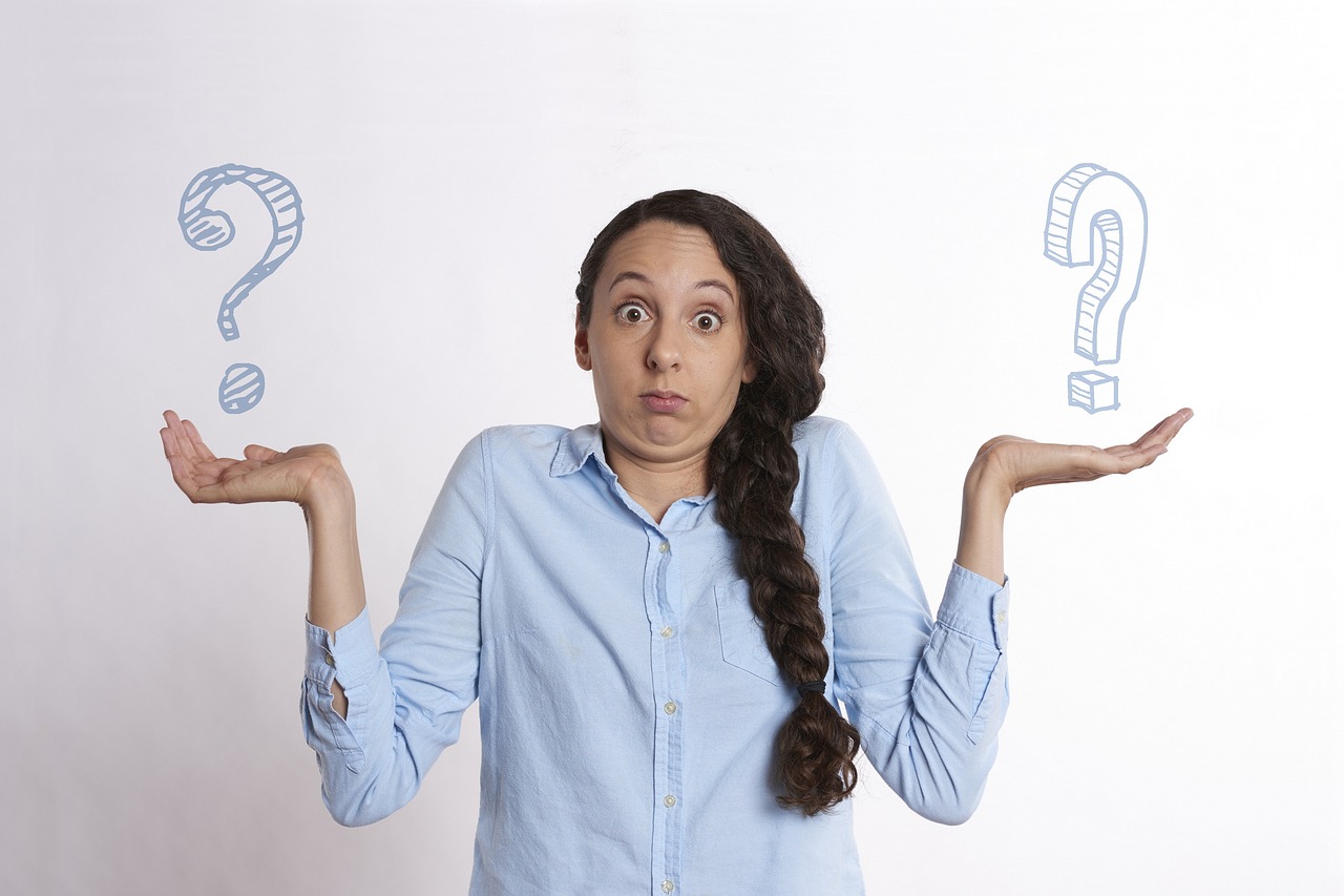 A person shrugging with both palms raised, with illustrated question marks floating beside them, conveying confusion and uncertainty about choices