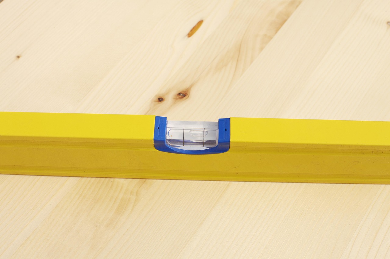 A spirit level resting on a wooden surface