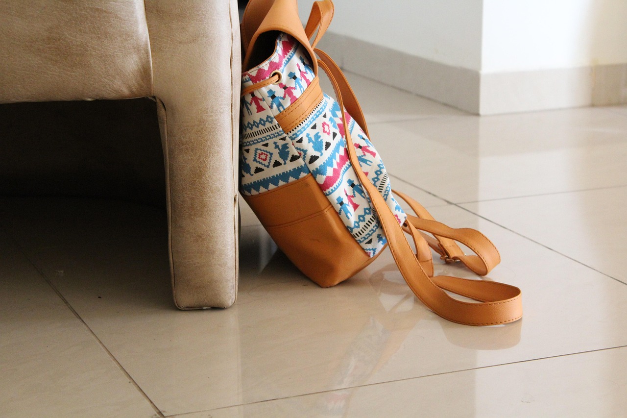 A bag set down beside a chair, representing the relief of making big decisions feel less heavy.