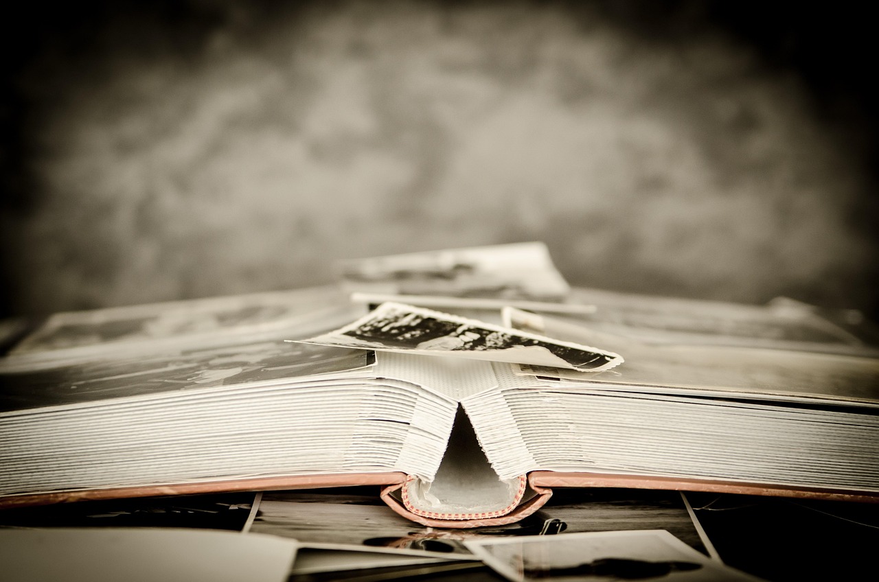 An open photo album on a table, representing future memories, hindsight and financial decisions made with less regret.