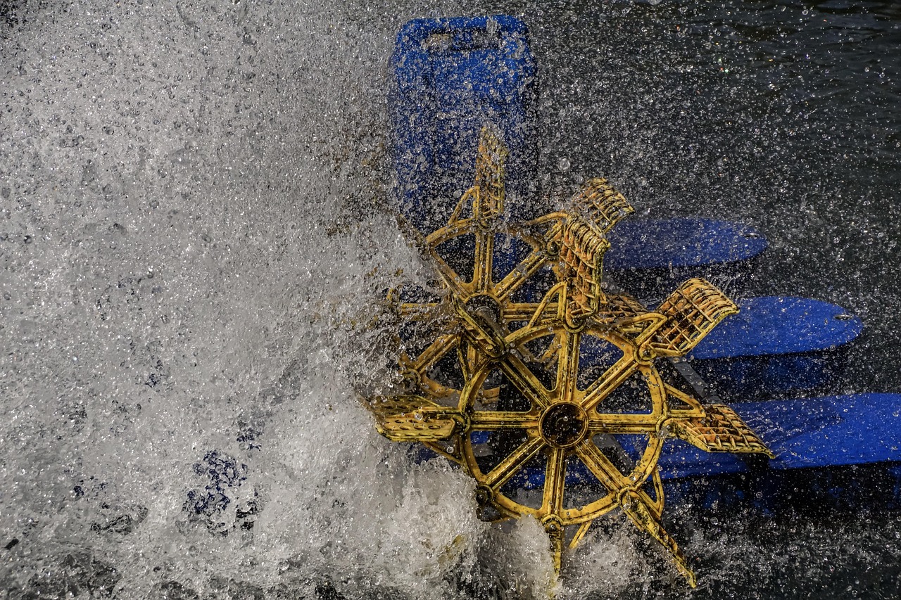 A water wheel turning through fast-moving water, representing a strategy using volatility rather than trying to predict it