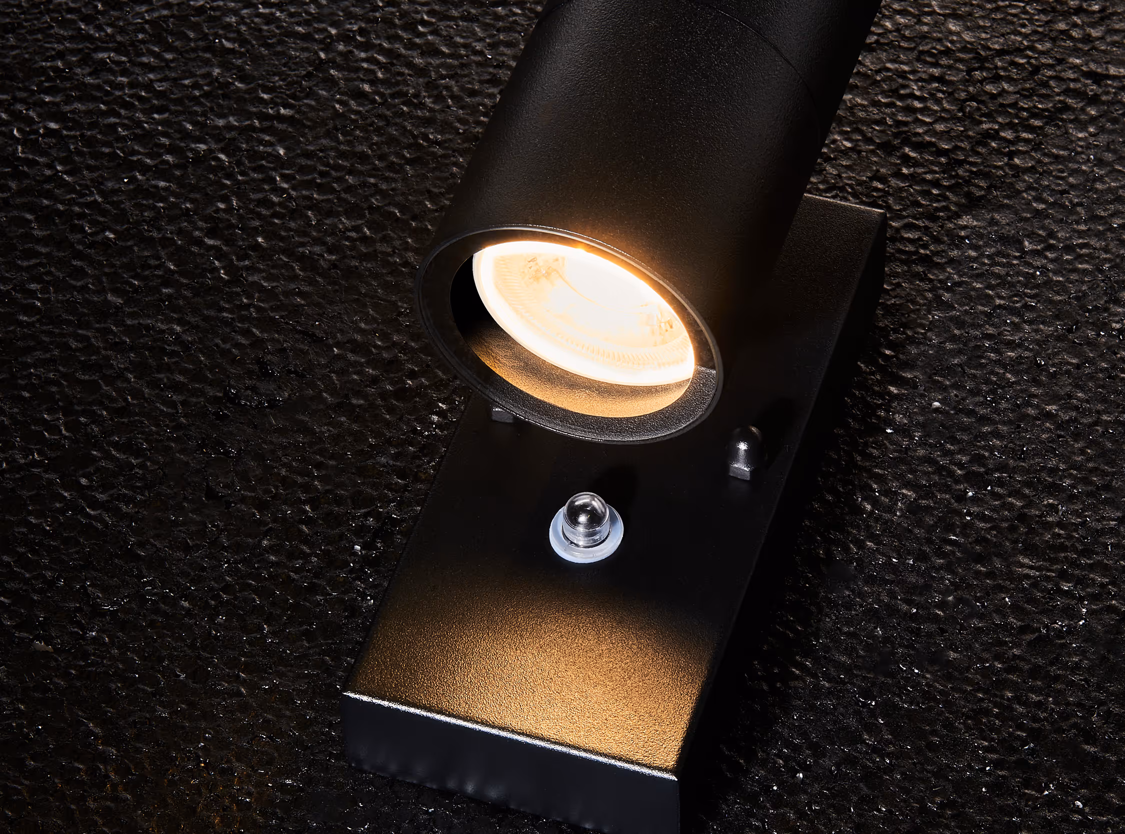 Splash proof up and down wall light with photocell 