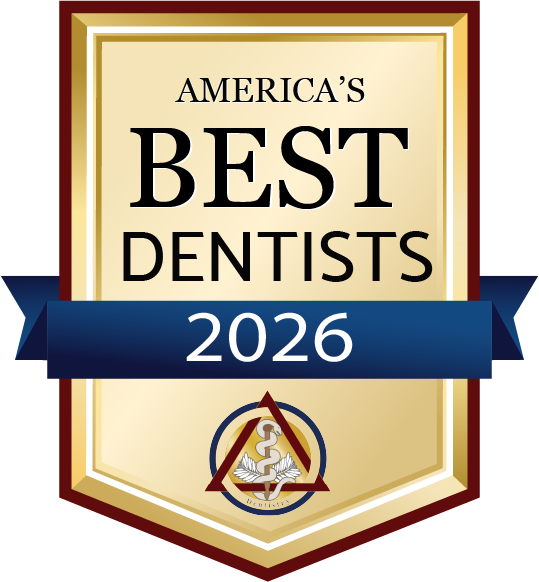 Gold badge reading America’s Best Dentists 2026 with a caduceus dental emblem at the bottom.