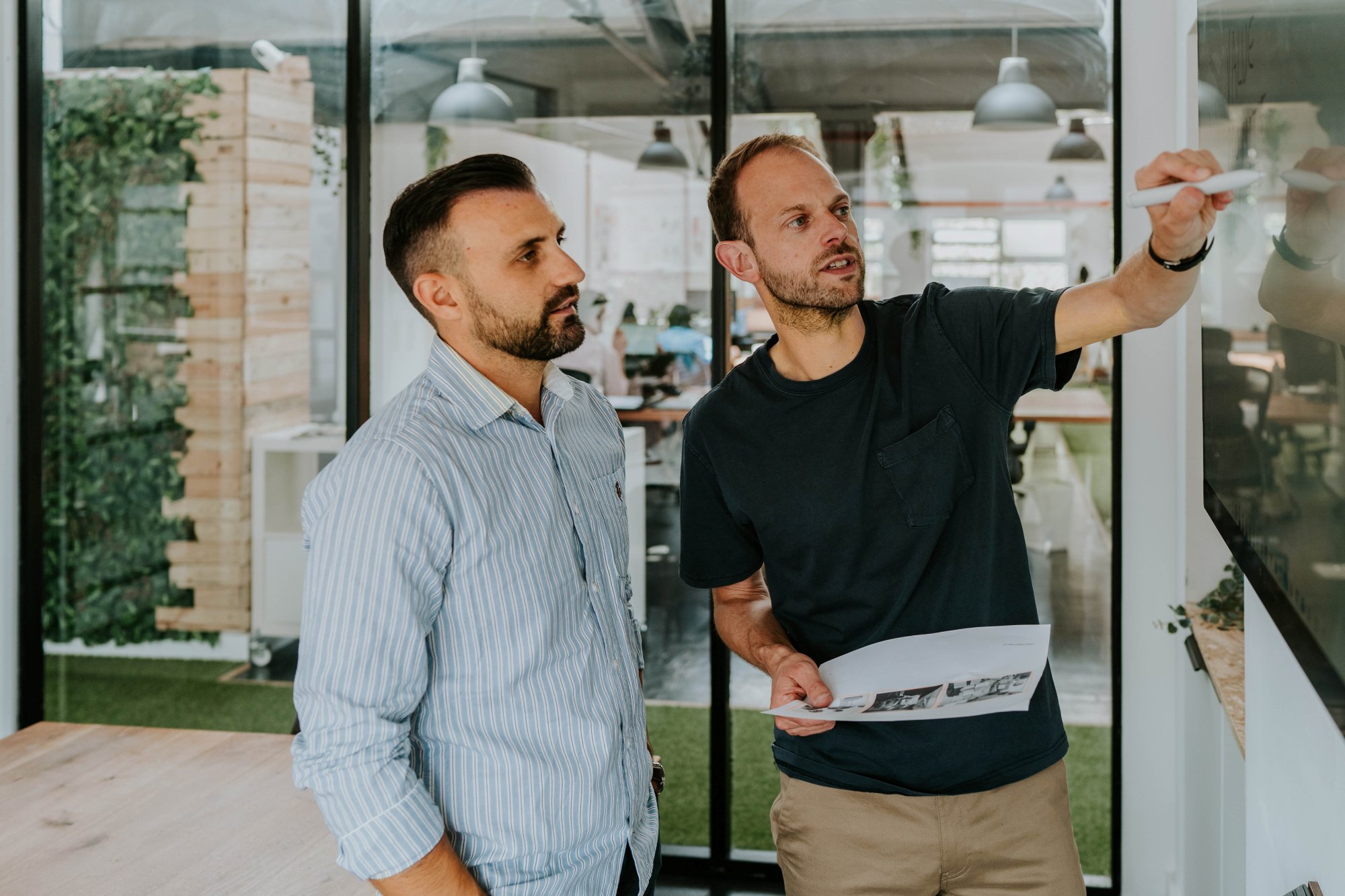 Paul Laker presenting change management strategies to a business owner during a workshop session