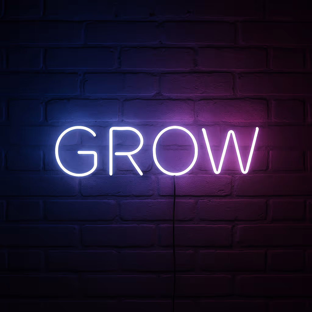 Neon-Schriftzug „GROW“ auf dunkler Wand – Symbol für Wachstum und Innovation