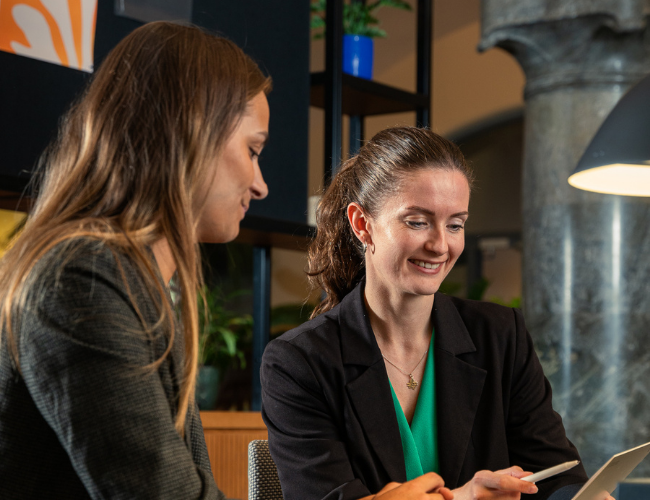 Cemasys employees talking and smiling in a conversation