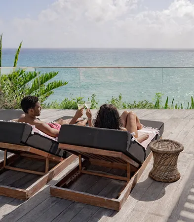 Couple Enjoying a Hot Tub with a Glass of Champagne at La Toubana Hotel & Spa in Guadeloupe