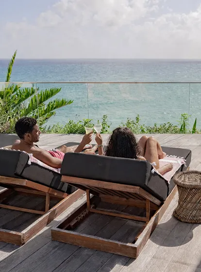 Couple Enjoying a Hot Tub with a Glass of Champagne at La Toubana Hotel & Spa in Guadeloupe