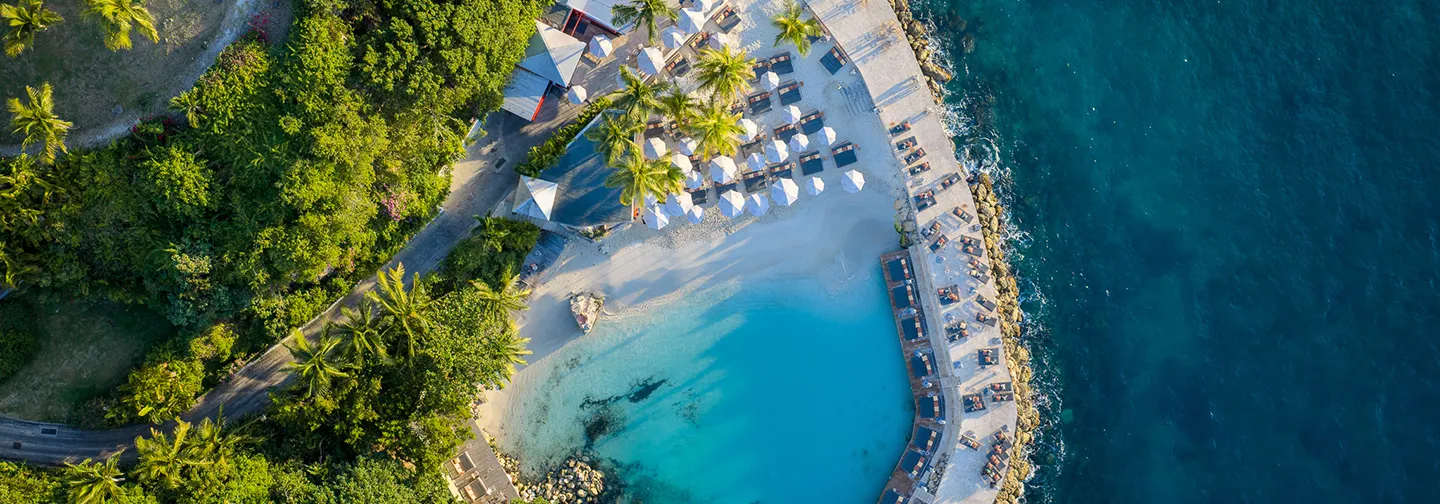 Couple Enjoying a Hot Tub with a Glass of Champagne at La Toubana Hotel & Spa in Guadeloupe