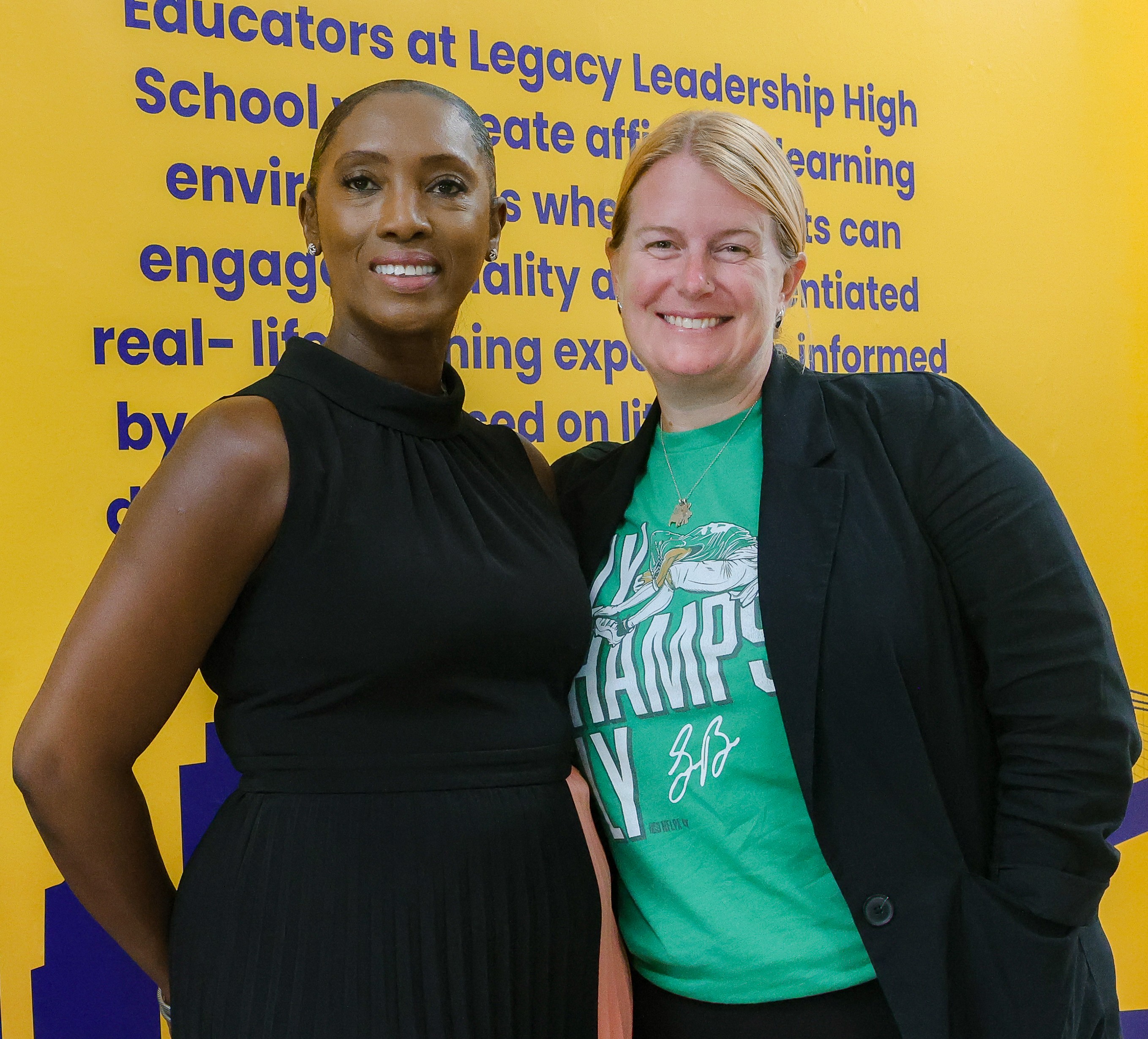 Two Legacy Leadership High School staff members smiling together