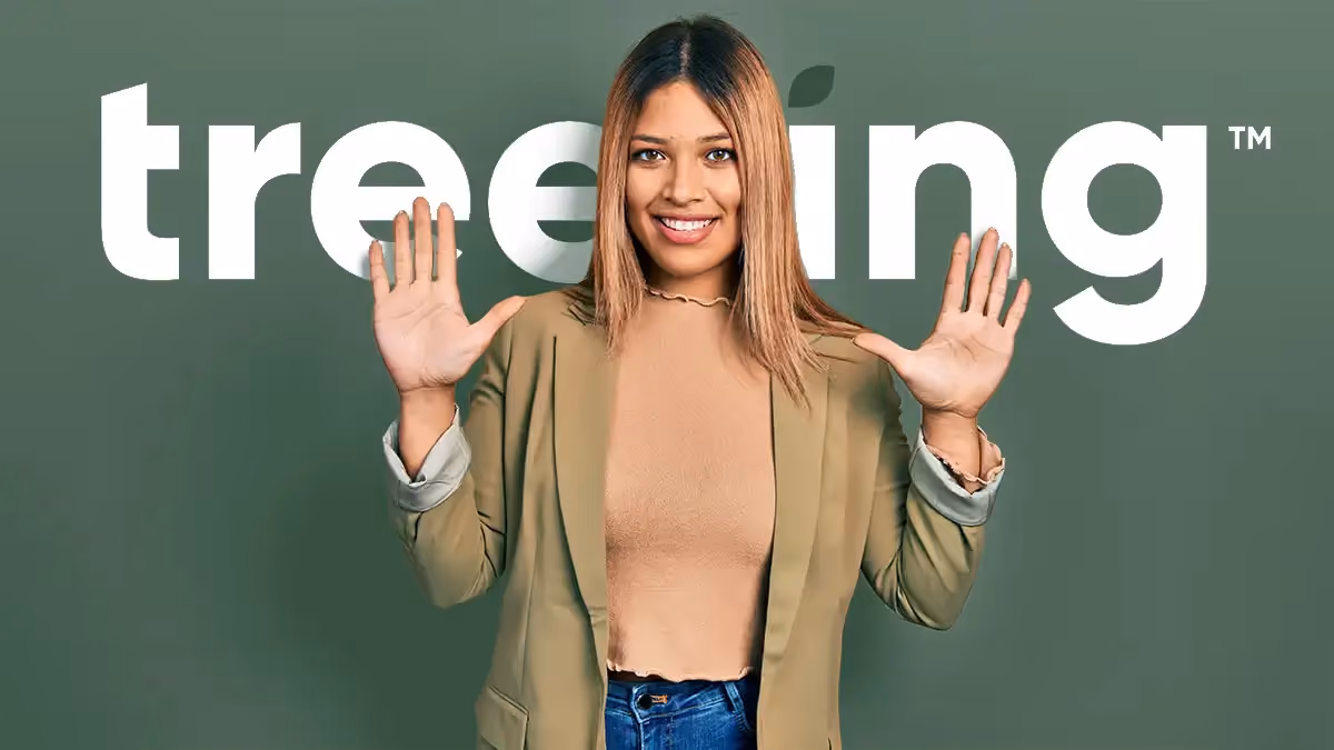Smiling woman holding up both hands with fingers spread in front of a green background with 'treering' text.