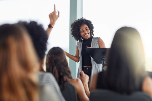 Use of depth of field and angles are the tips that captured this photo of a classroom teacher giving a presentation during orietntation