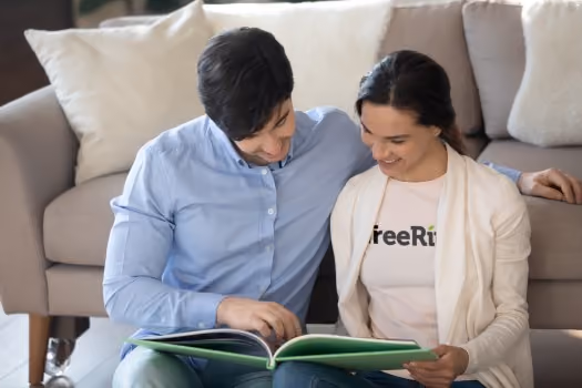 Couple reminiscing over their middle school yearbook tradition