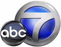 ABC7 news logo with a blue circle and silver border featuring the number 7 and abc letters.