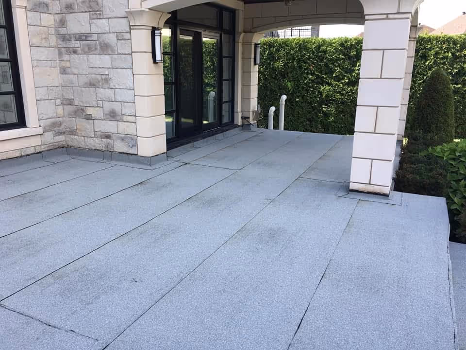 A roof with a gray covering.