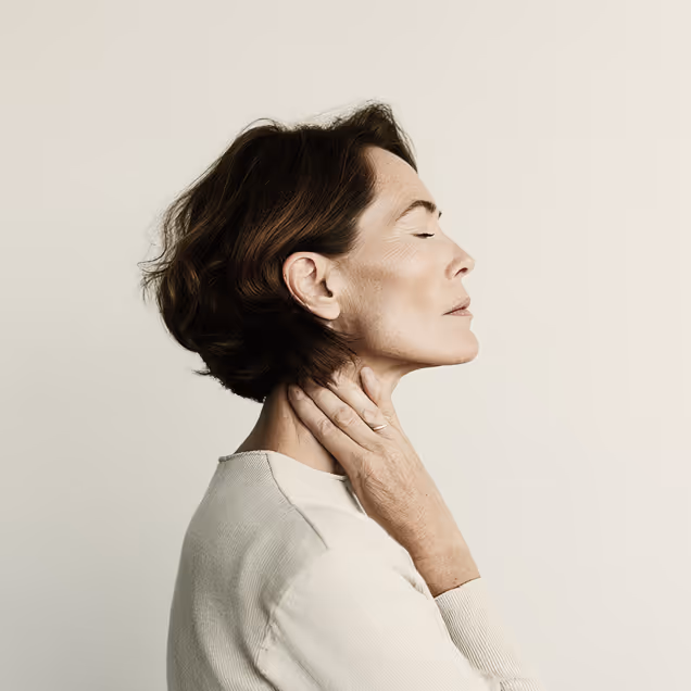 Woman touching her neck