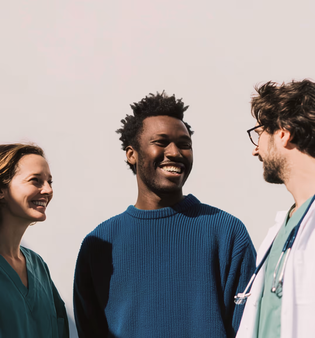 Two doctors with african man