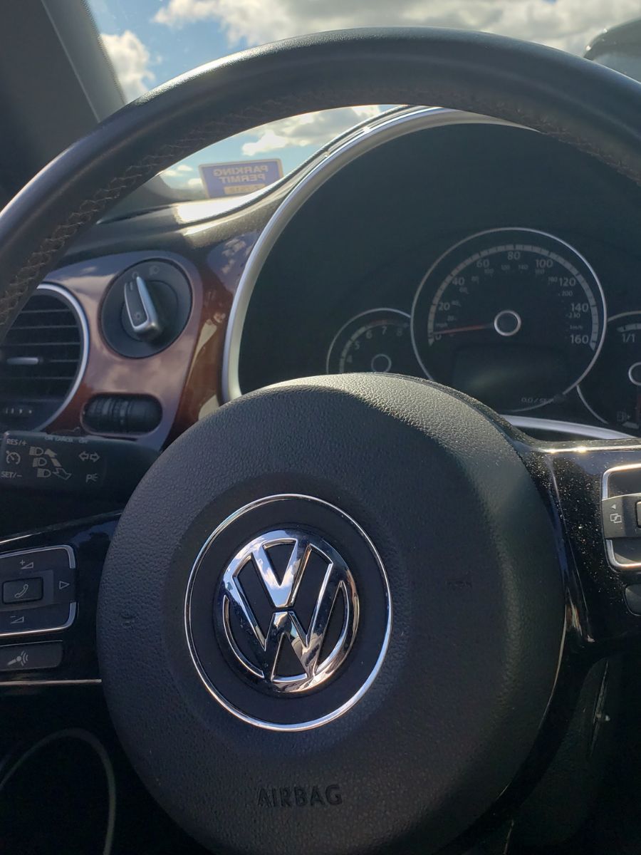 Car dashboard and steering wheel representing the marketing engine for small businesses
