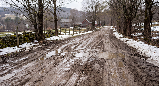 Muddy Vermont road during spring thaw
