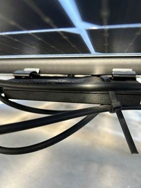 The image shows a black external hard drive connected to a computer with a reflective, possibly solar-themed background.AI-generated content may be incorrect.