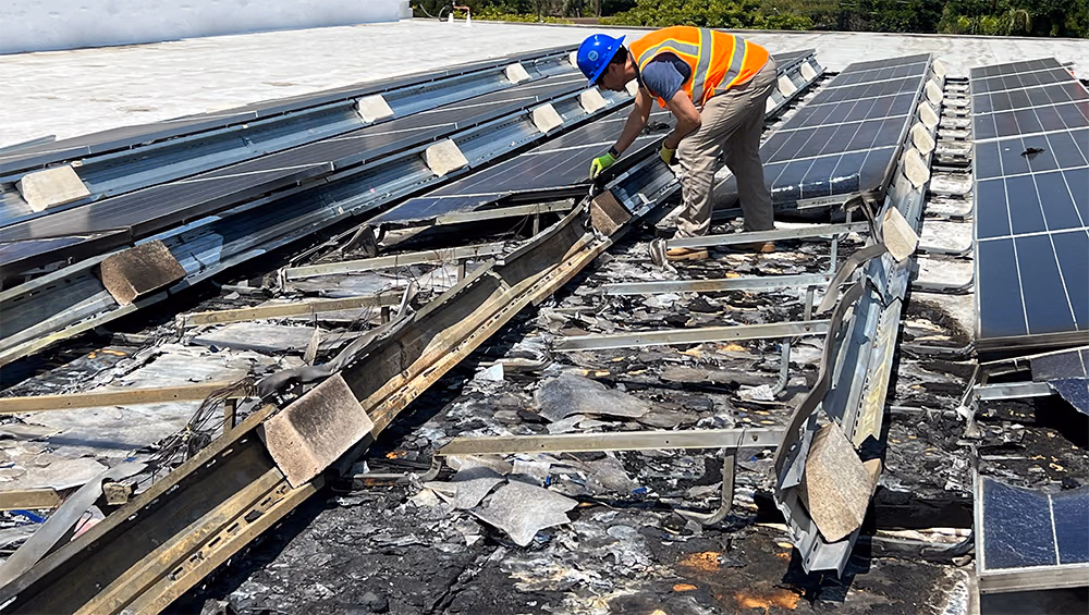 A solar PV fire on a rooftop being inspected by Heliovolta