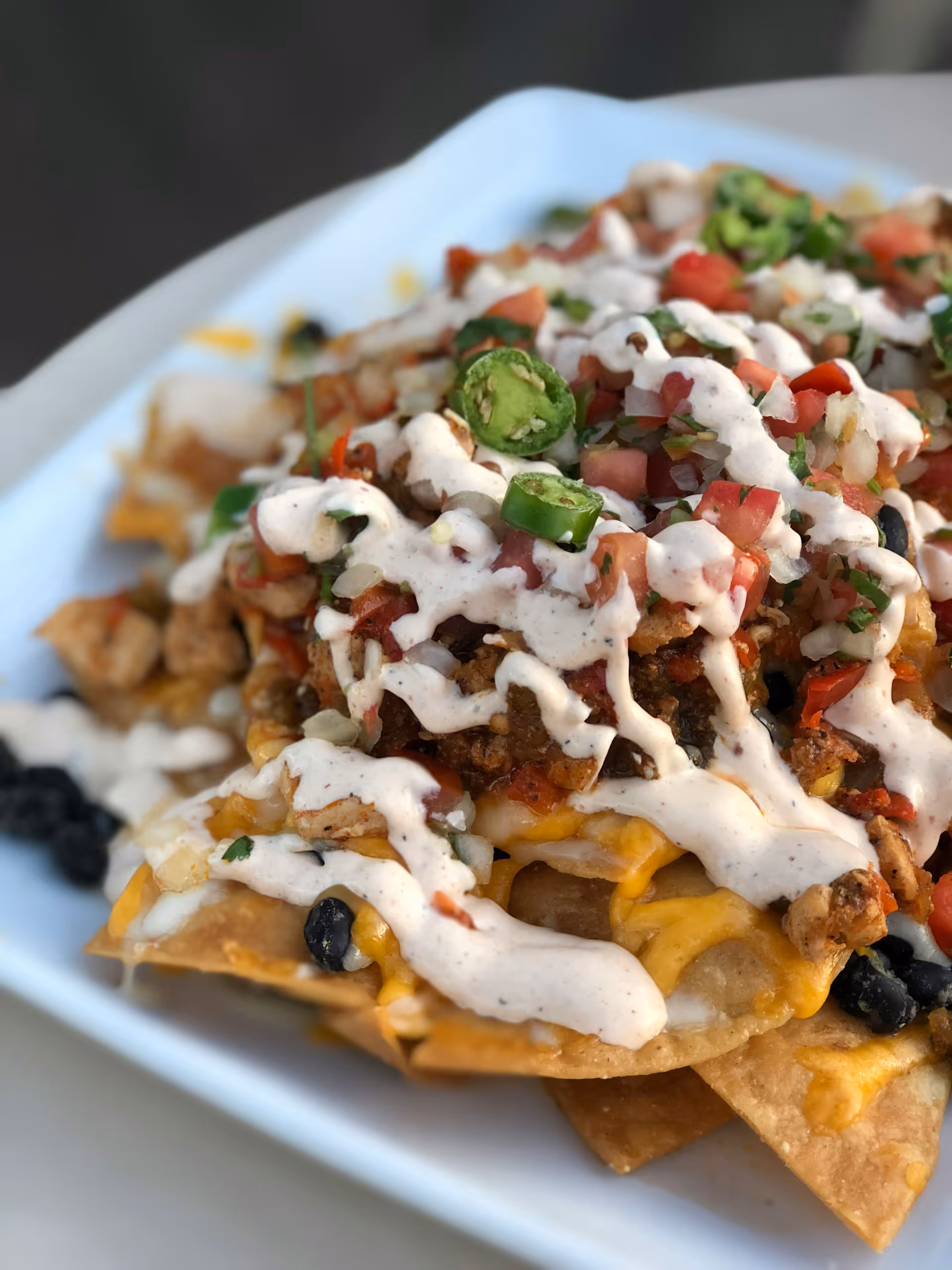 mexican nachos with jalapenos on top