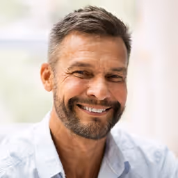 bearded guy smiling