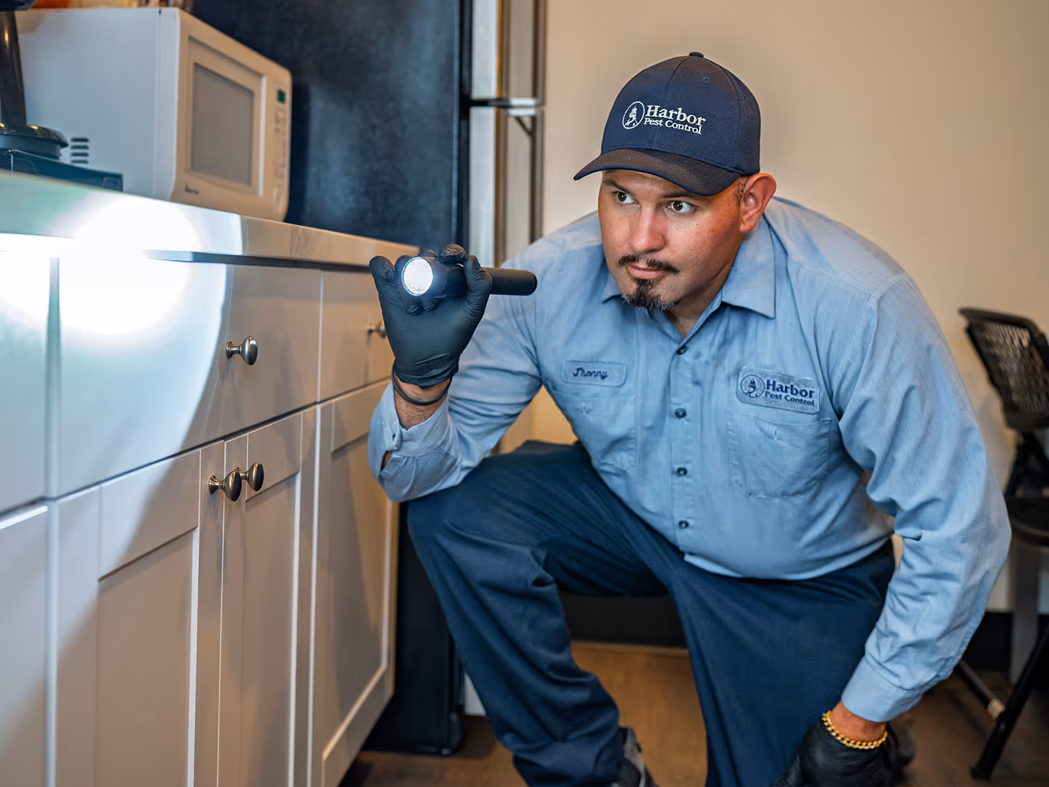 pest pro inspecting a breakroom