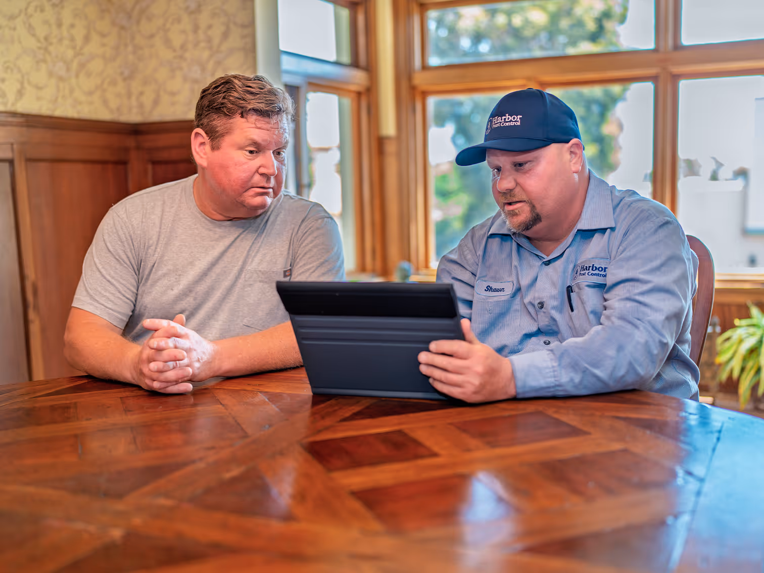 tech explaining bed bug treatment process