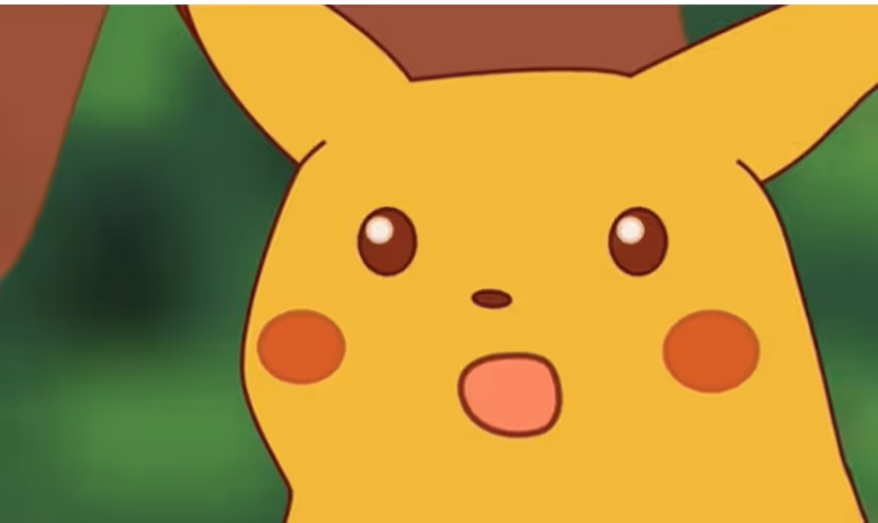 A close-up of the Pokémon Pikachu with a shocked expression and his mouth open, famously known as the 'Surprised Pikachu' meme