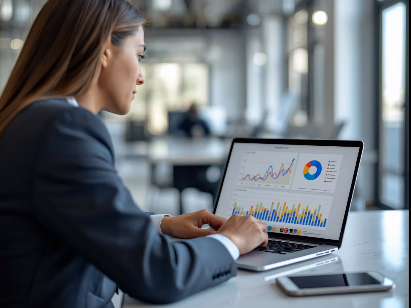 Business professional analyzing Google Ads campaign performance on laptop.