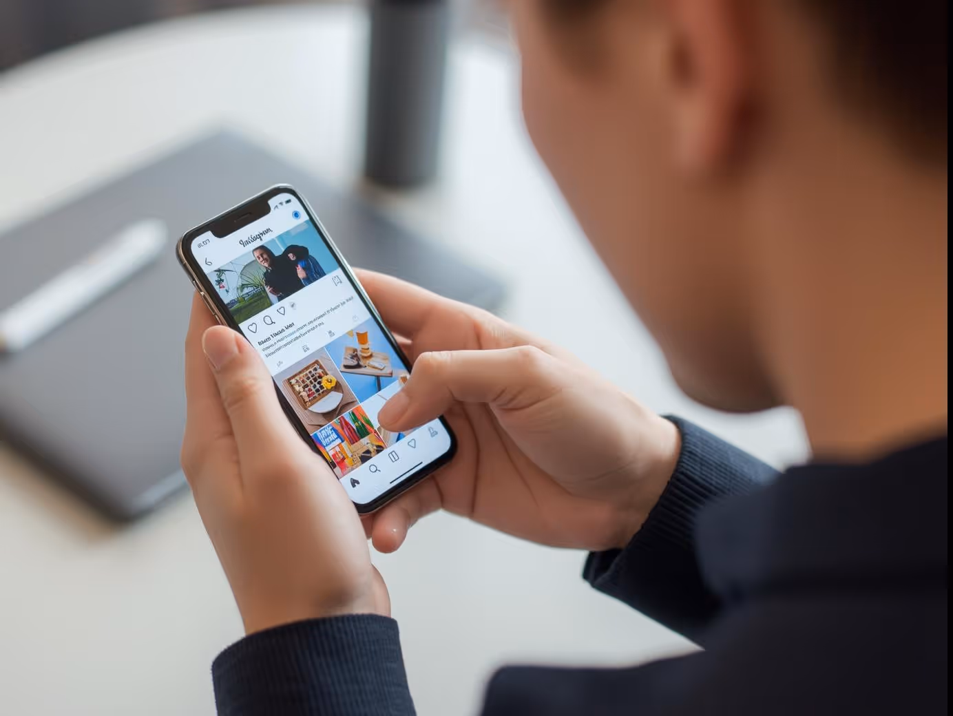 User engaging with Facebook and Instagram ads on smartphone in casual setting.