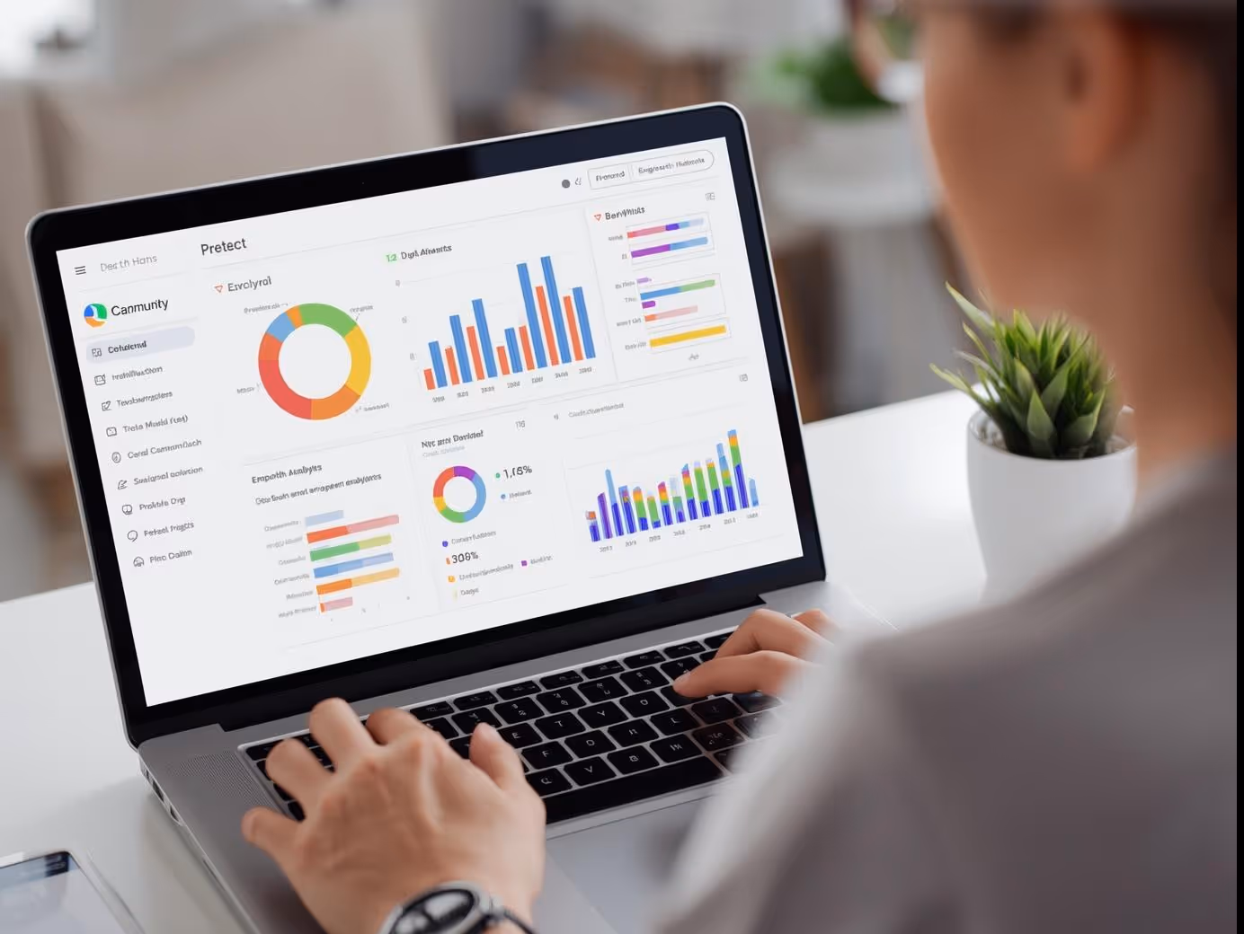 Community manager analyzing engagement data on laptop dashboard