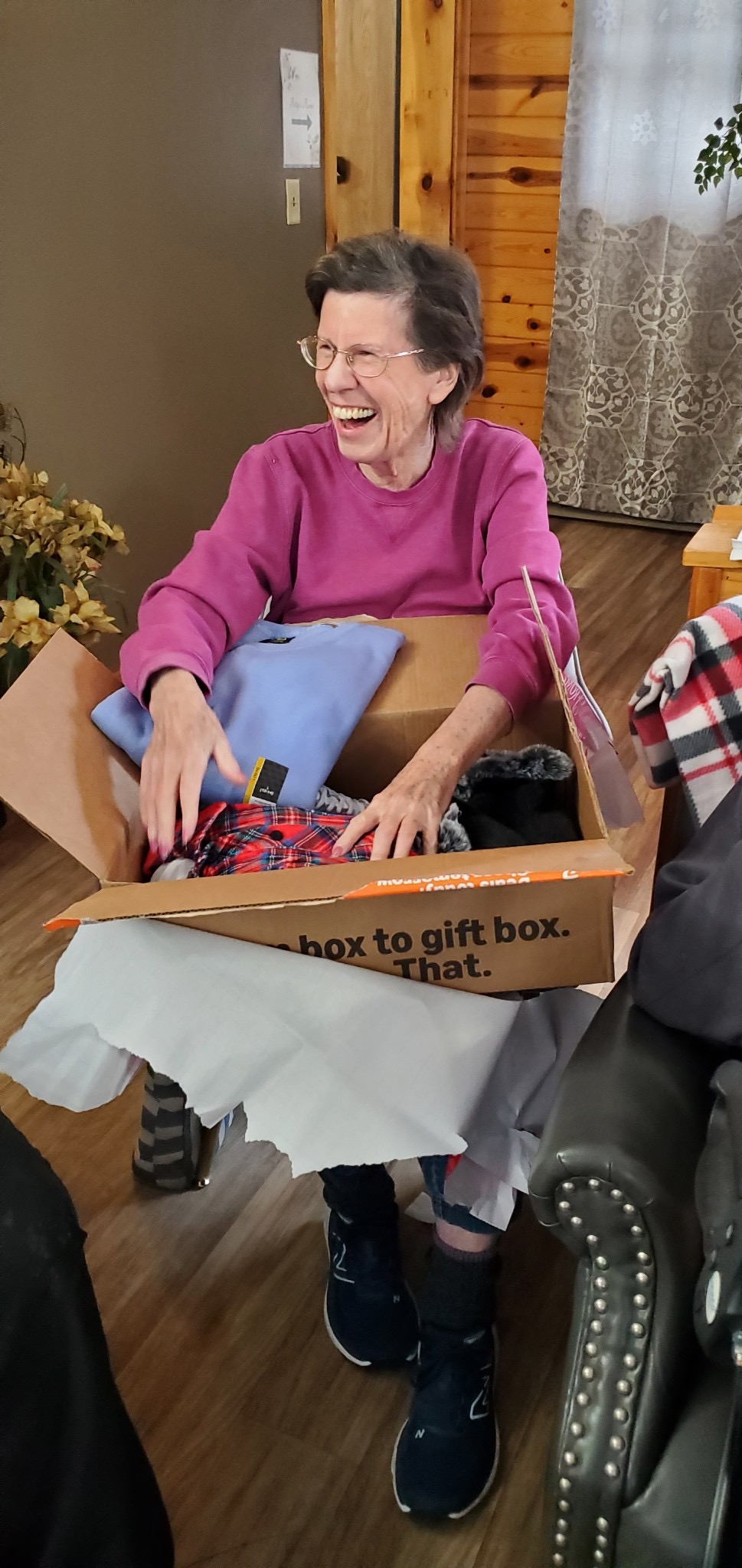 A resident opening a package or present