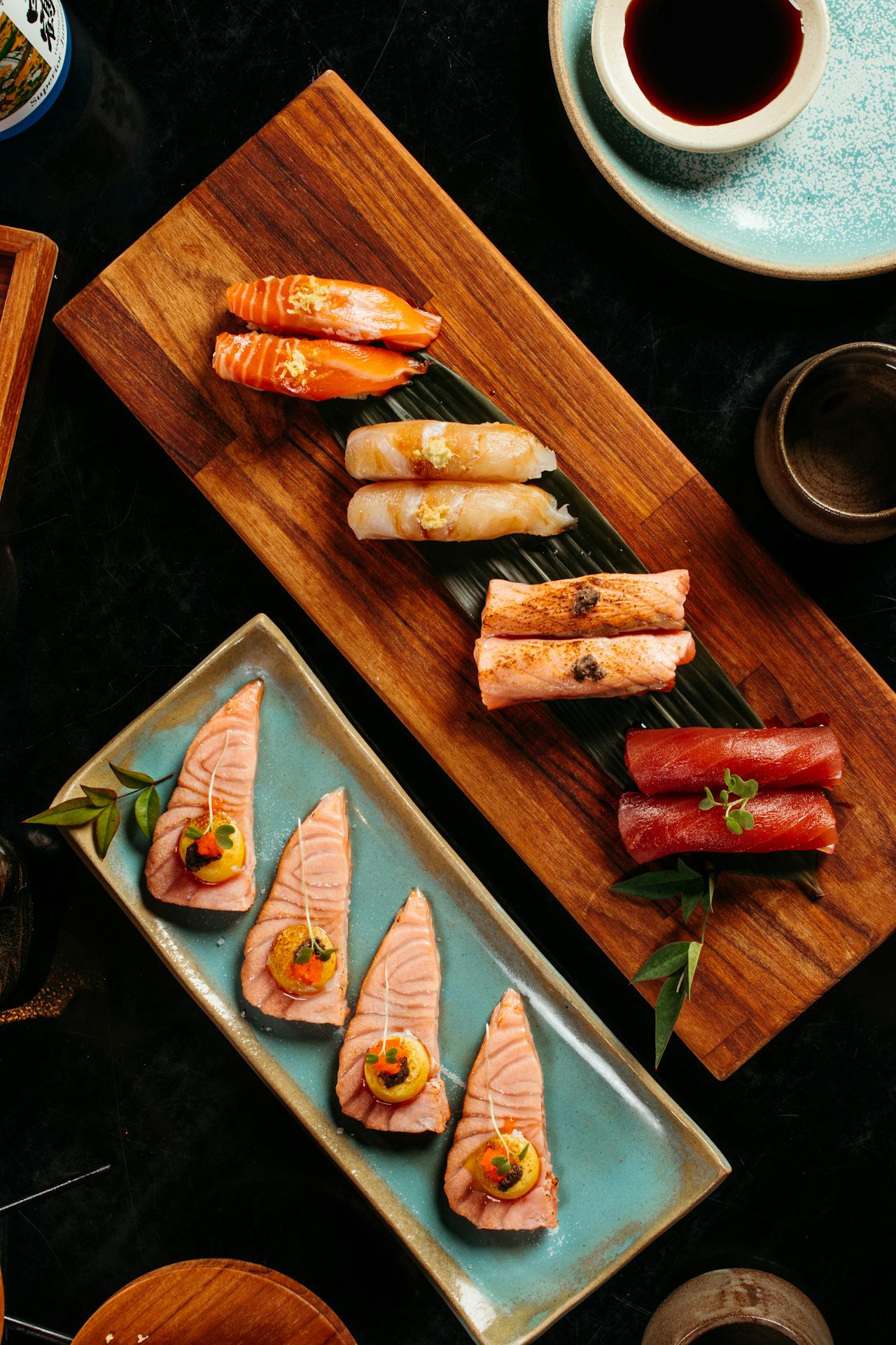Beautiful plates with sashimi and nigiris.