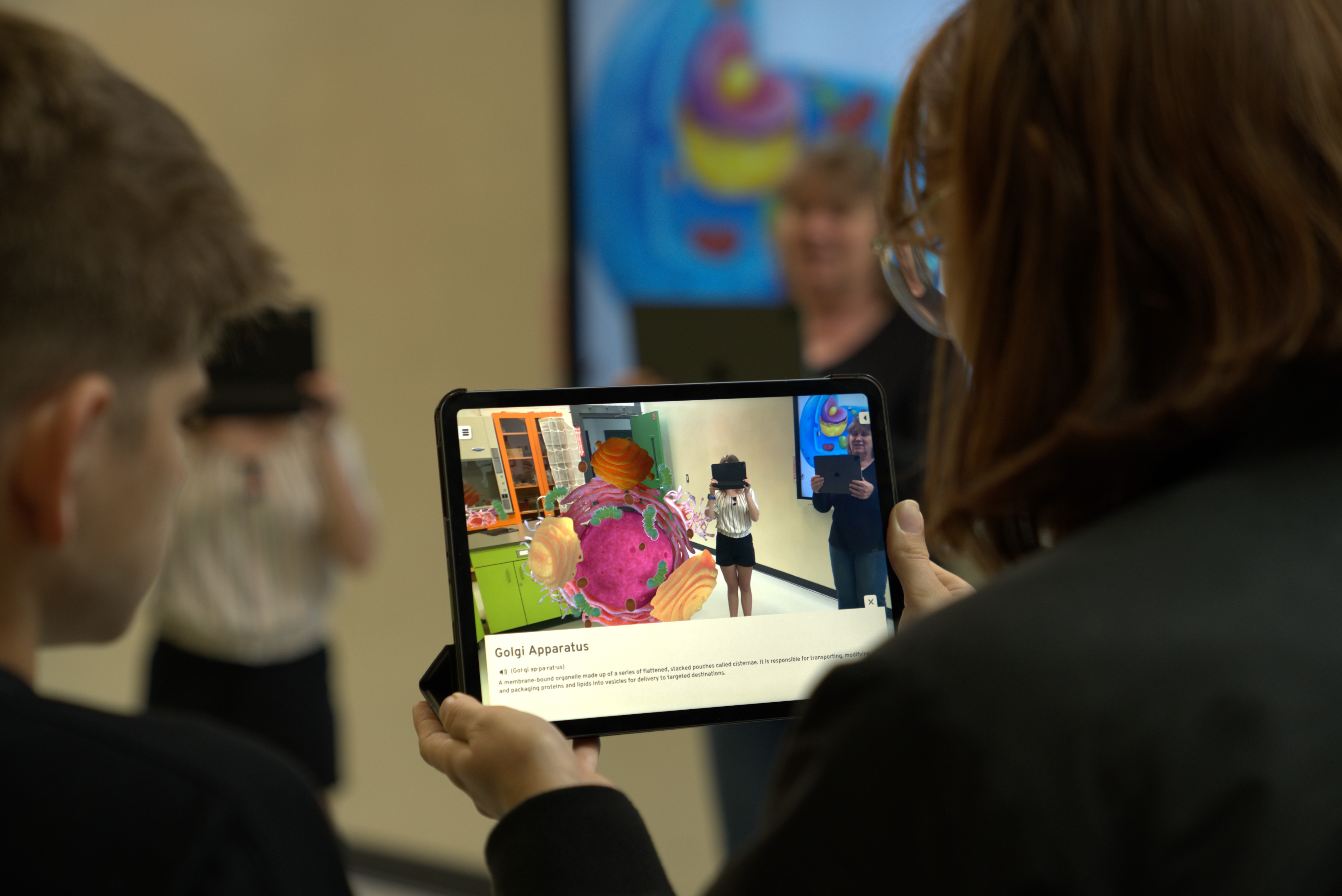 Two students using tablet with Step into Biology app
